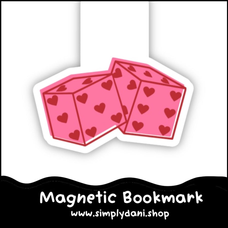 Pink dice-shaped magnetic bookmark with heart patterns on a white background, branded 'Simplydani.shop'.